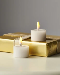 Raz 1.75" Ivory Battery Operated Tealight Candles With Melted Tops And Realistic Flame 4559439